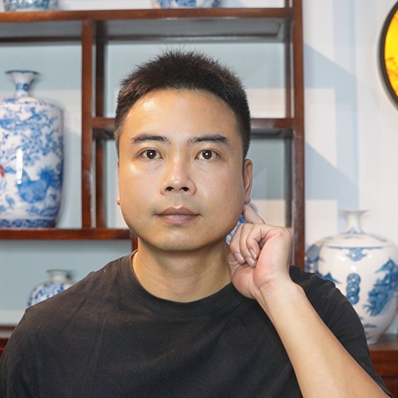 Nguyen Duy Phong looking at the camera, pressing a spot beside his ear